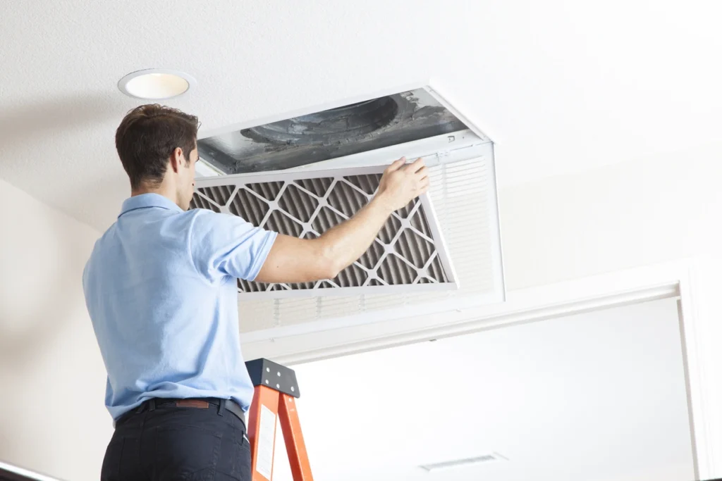 Duct Cleaning Services 1 A professional technician cleaning an air duct